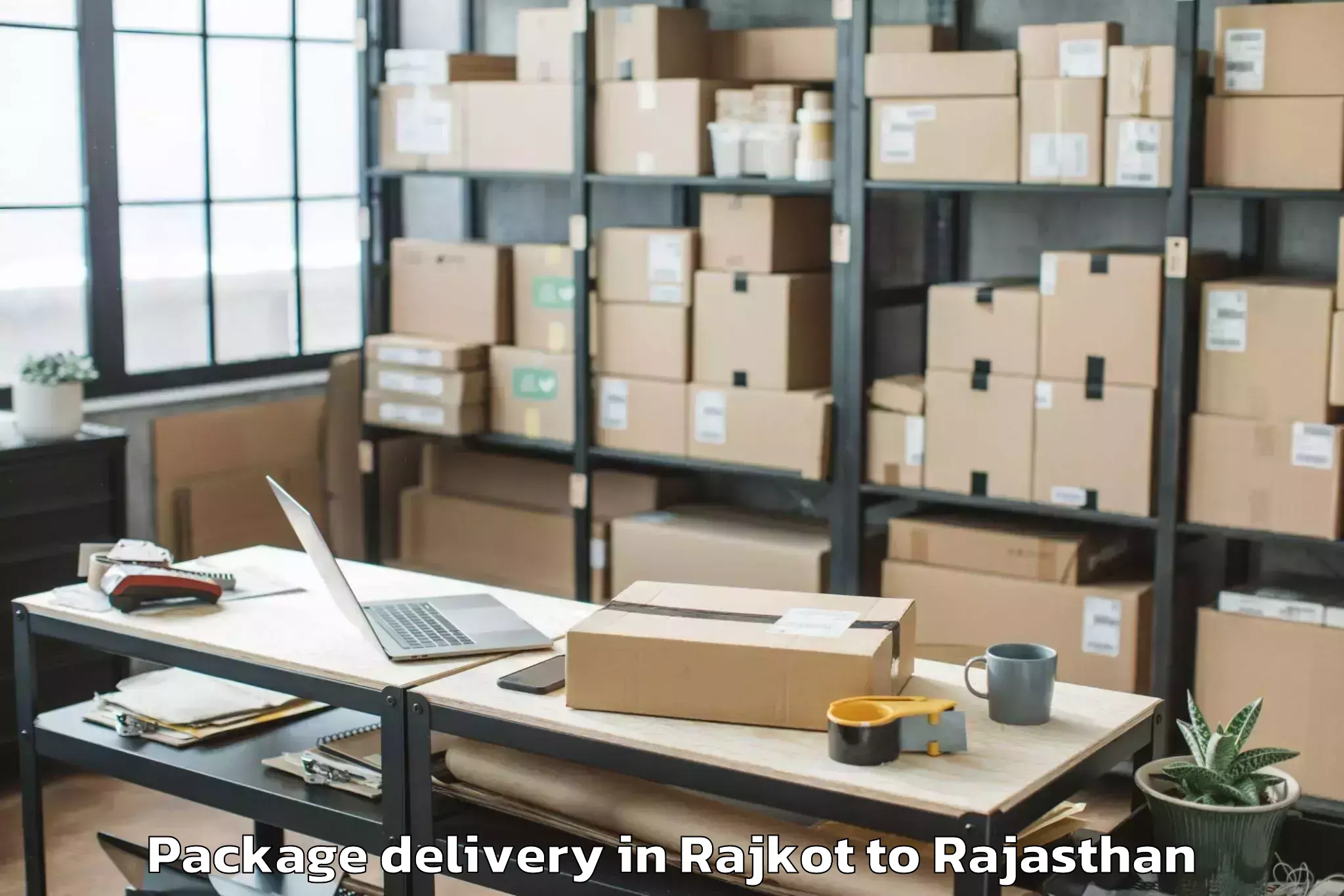 Top Rajkot to Padampur Package Delivery Available